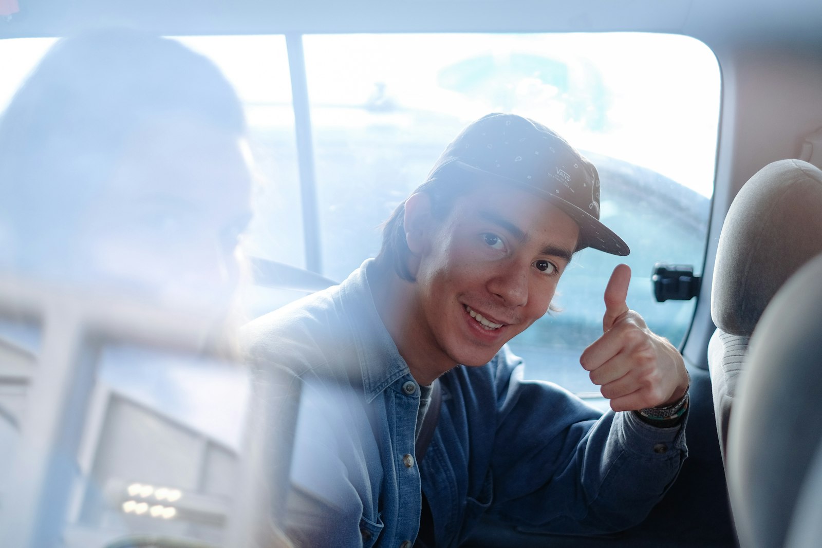 A learner giving a thumbs up after passing